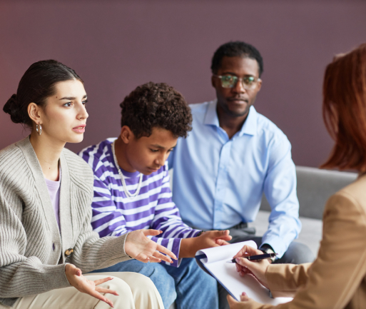 Man counselling couple during divorce mediation